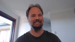 Dan, a man sitting indoors, smiling and taking about regaining sleep confidence