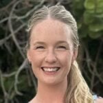 Casaundra has blonde, shoulder length hair and is smiling at the camera